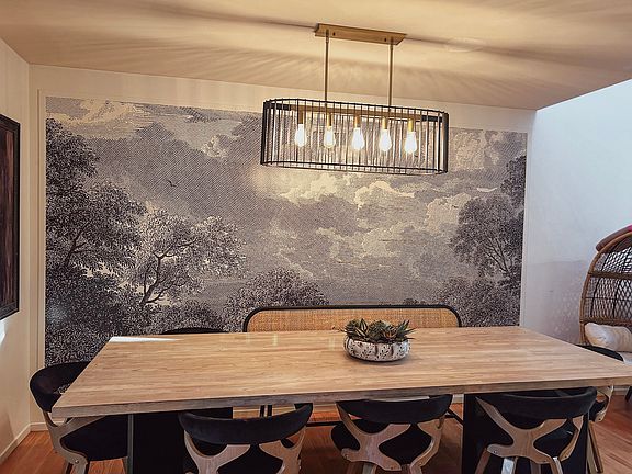 dining room with mural