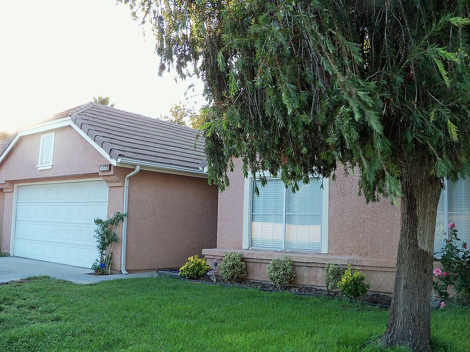 attached garage & shade tree