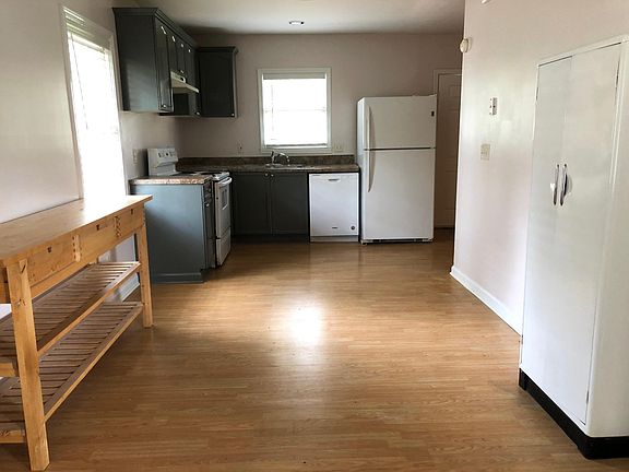 Large kitchen looks into back yard