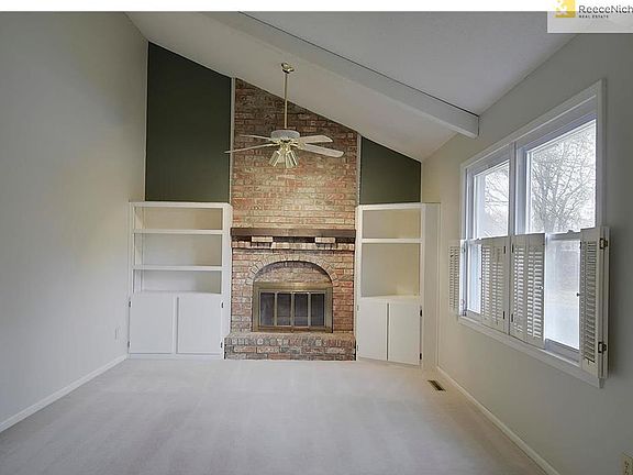 Great room with built in and wood burning fireplace