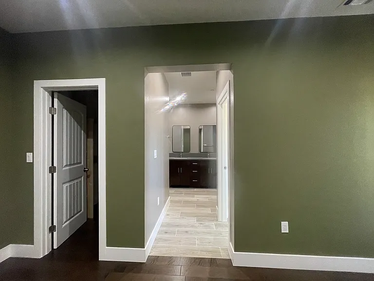 Master/Main Bedroom - Partial View of Walk In Closet & Master/Main Bath