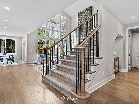 Wide iron stairway to the upper level.