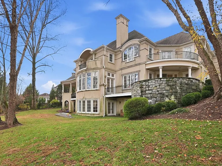 Elegant estate with lush surroundings.
