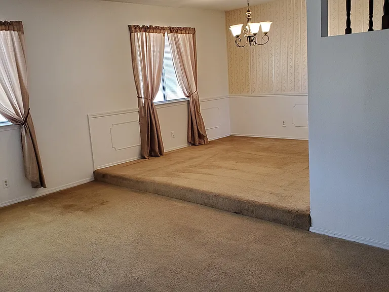 living room and dining room, drapes, light fixture before furniture