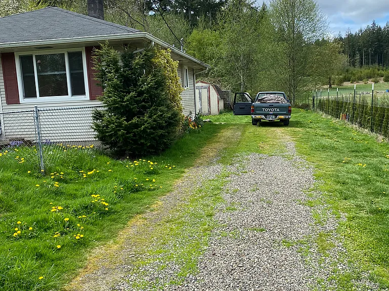 Lots of parking and small storage shed.