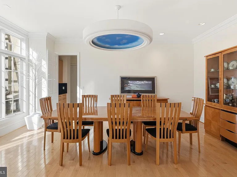 Elegant dining space with skylight.