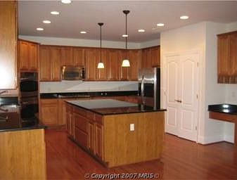 Gourmet Kitchen with granite island and countertops.