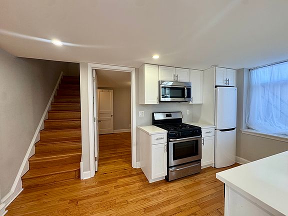 Spacious kitchen with breakfast bar and dishwasher
