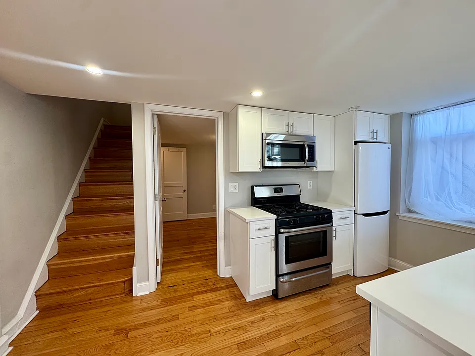 Spacious kitchen with breakfast bar and dishwasher