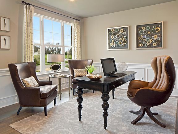 Study with desk and wingback chairs