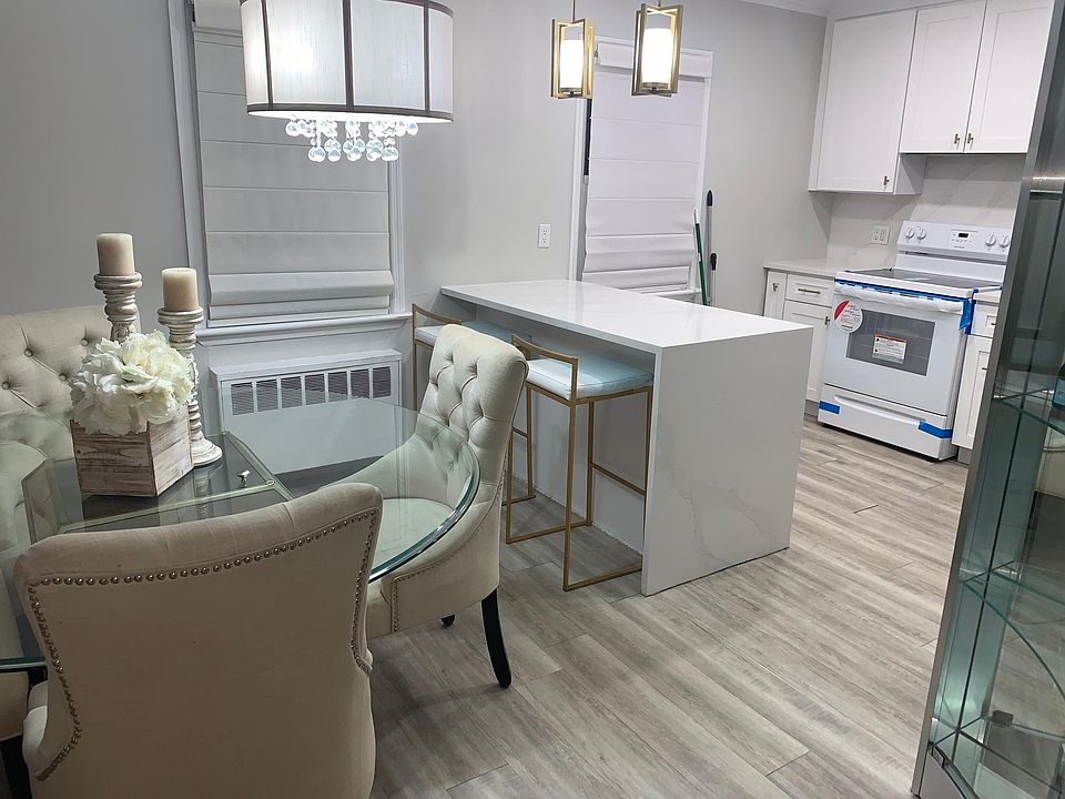 Kitchen with remodeled kitchen and brand new stove and refrigerator, excellent illumination, and heat.