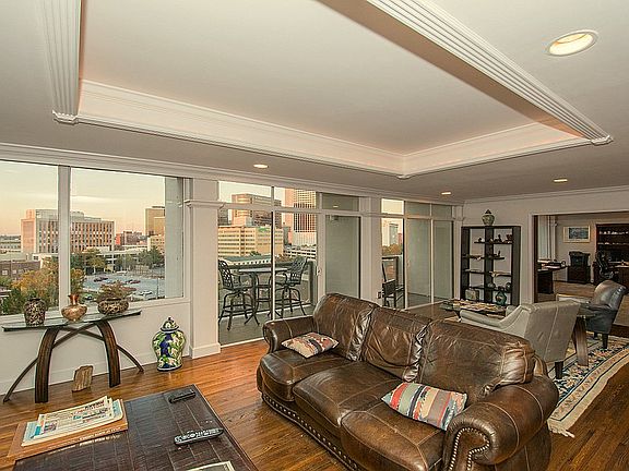 Sleek and fresh are words that best describe this space! Note the expansive views from the wall of windows.