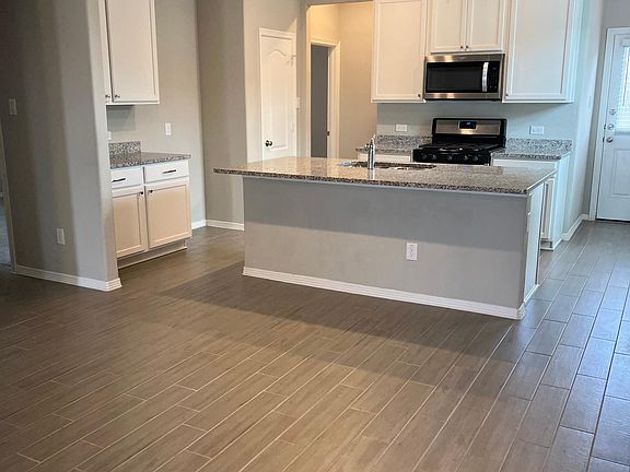 Great bar with stainless steel sink. Large kitchen area.