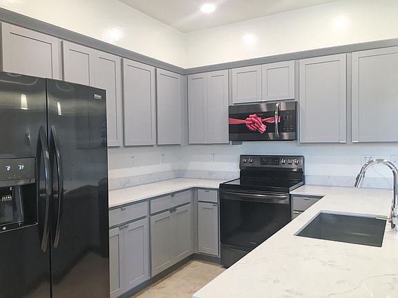Modern Kitchen with black stainless steel appliances