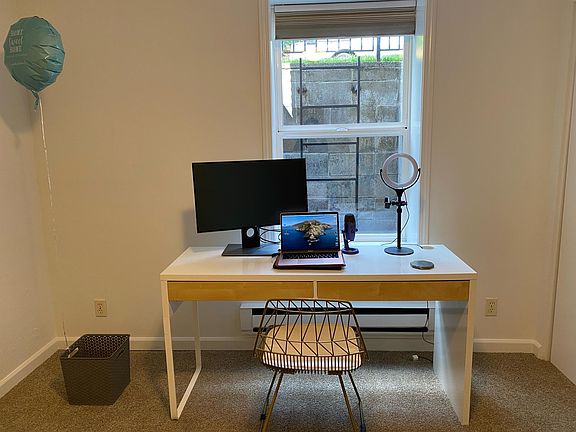 1st bedroom that is currently set up as office with desk and chair has large closet.
