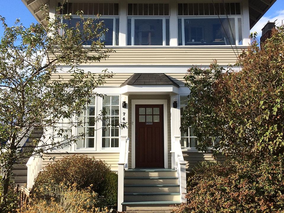 Front of house, showing the lower unit front door, porch, an