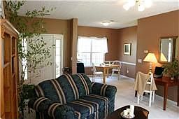 Living room looking toward foyer and dining area