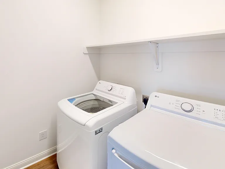 The Pyle floor plan includes a laundry room with a full-size washer and dryer and custom shelf. The Pyle floor plan includes a laundry room with a full-size washer and dryer and custom shelf.