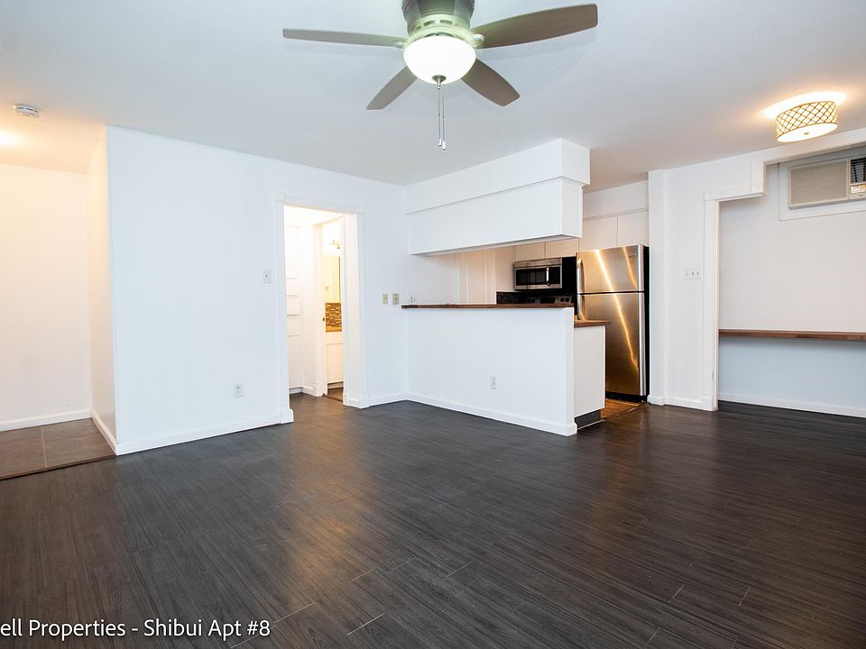 View of living area, kitchen, and built in desk