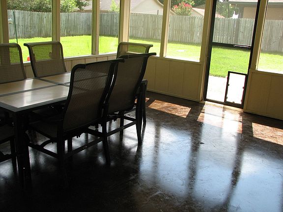 Back porch with stained concrete floor.