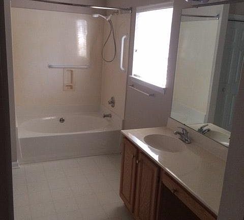 Master Bath with large walk in closet, linen closet and separate toilet room.