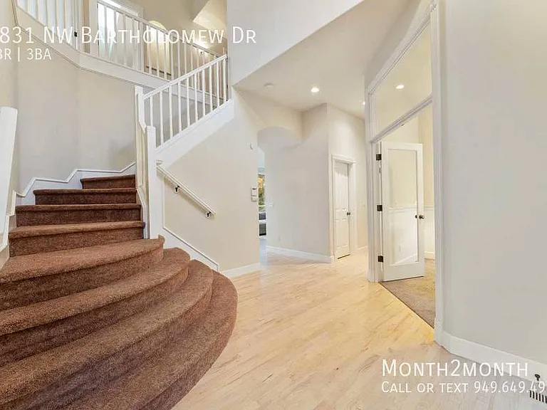 9831 NW Bartholomew Dr — Photo 29