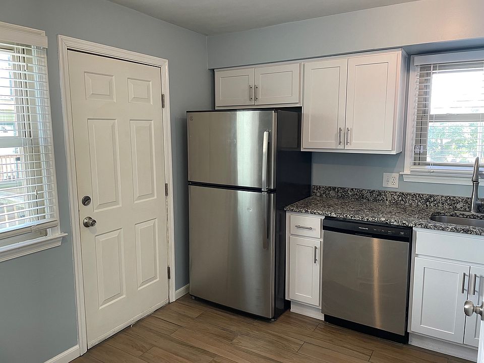 Kitchen: New flooring & cabinets.