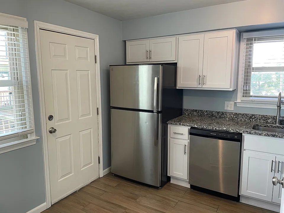 Kitchen: New flooring & cabinets.