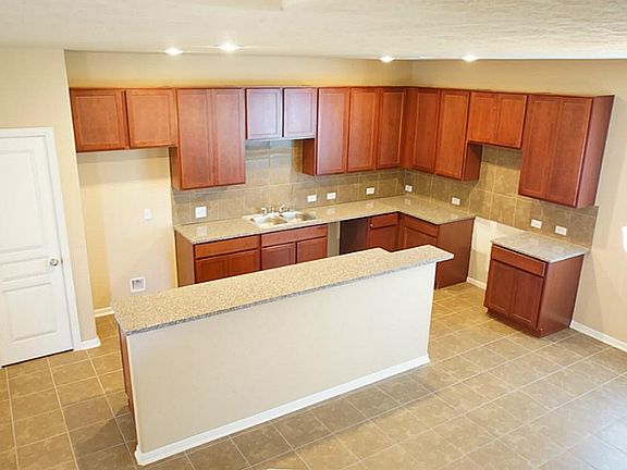 Chef's granite island kitchen with plenty of cabinet space.