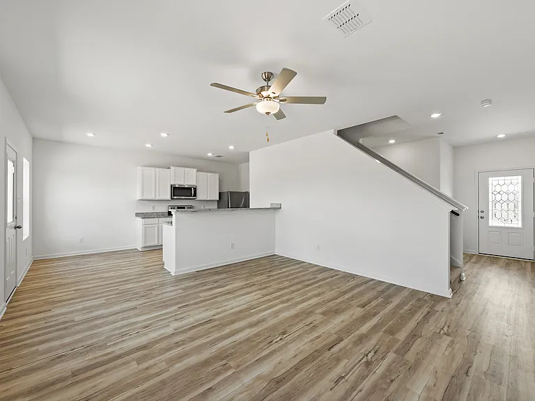 Open space with vinyl flooring.