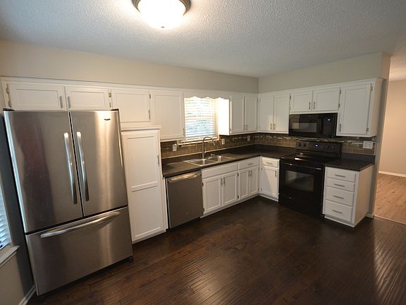 Kitchen view with formica countertop and tile backsplash