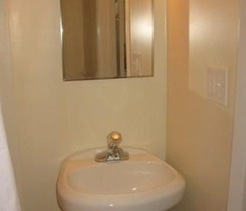 Bathroom sink - plentty of storage in medicine cabinet and a