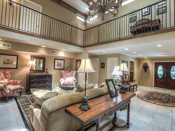Cantera stone tile flooring in the entry and grand living room