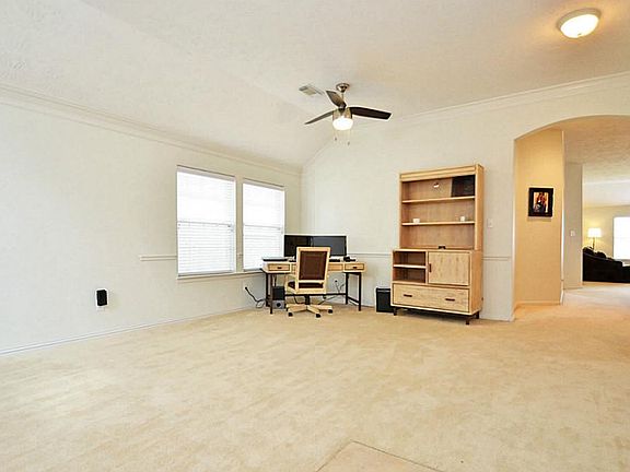 Formal dining space is currently being used as an office.
