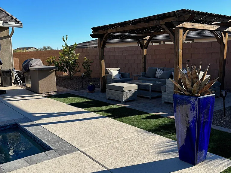Rear grill and pergola.