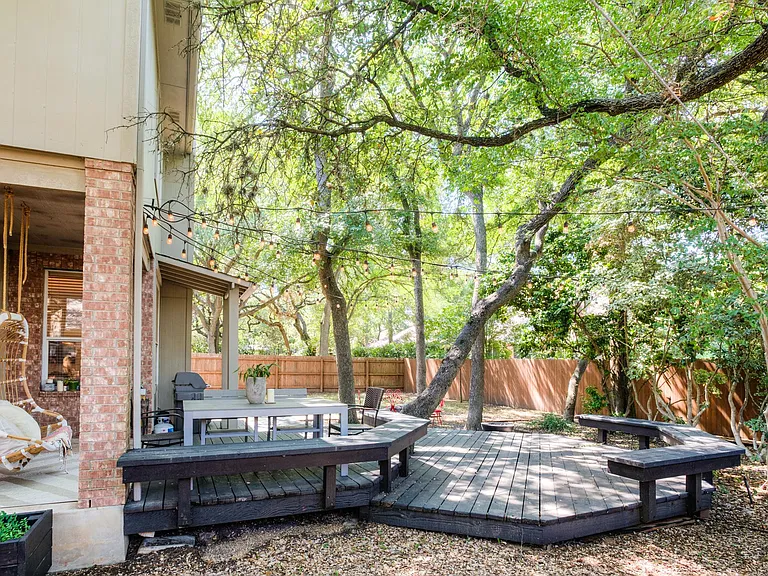 Large outdoor deck and yard with grill and fire pit