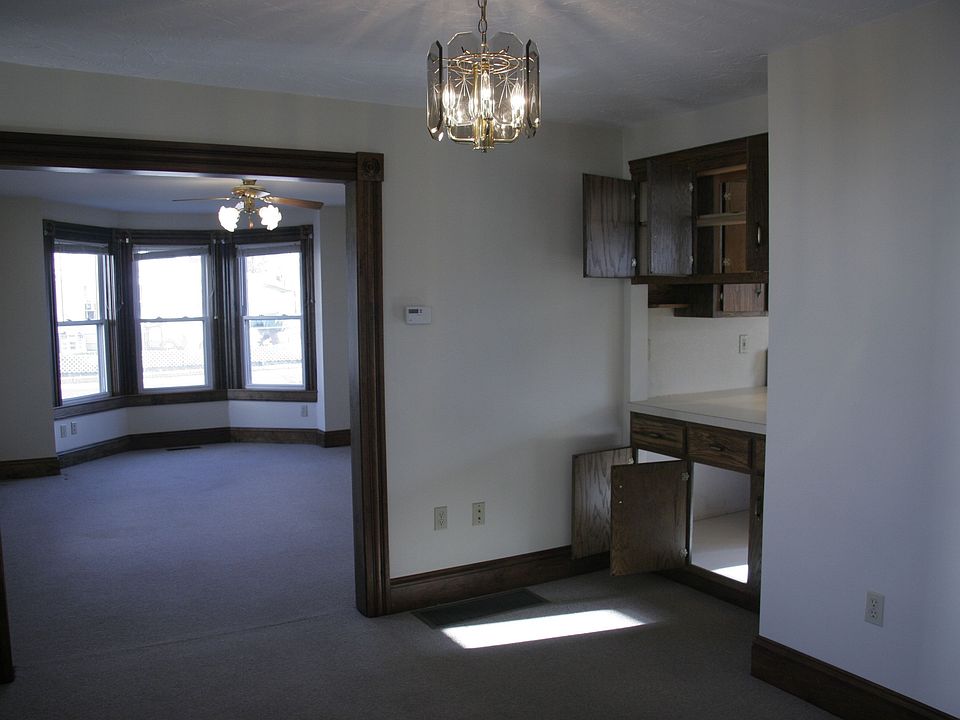 Standing in dining room looking into living room