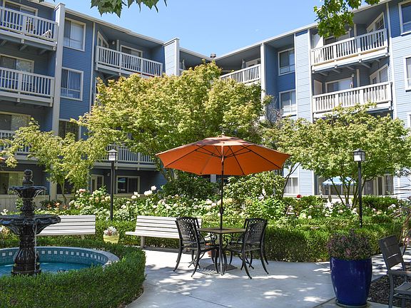 Bright and Inviting: Enjoy our peaceful courtyard, featuring lush trees, a serene fountain, and spaces perfect for activities and outdoor dining.