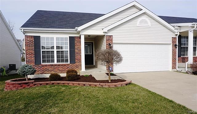 454 Angelique Place has a crisp brick front elevation & is professionally landscaped.