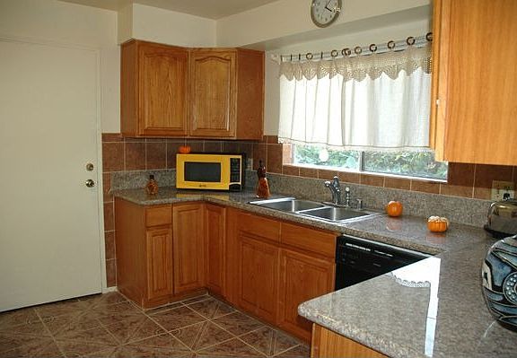 Kitchen with granite counter top and maple cabinets