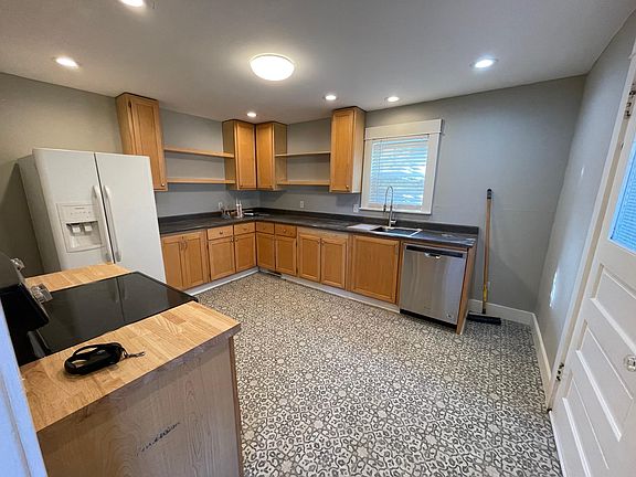 Large open kitchen, with brand new spacious sink, range and hood.