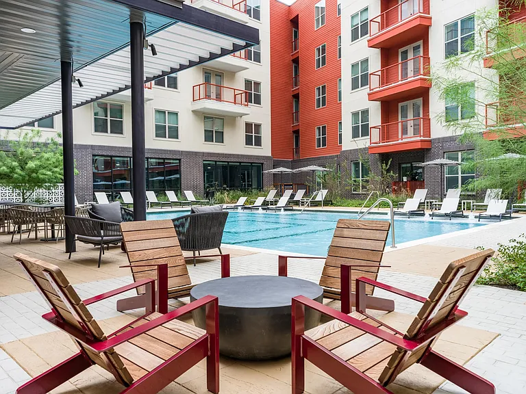 Unwind in the comfortable seating area near our resort-style pool, designed for relaxation and enjoyment.