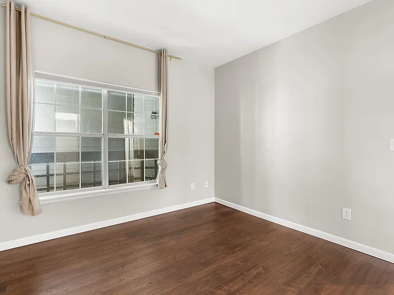 Alternate view of the second bedroom highlighting its flexible layout and functionality.