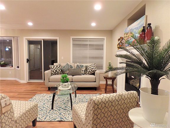 Your cozy family room with gas fireplace and sliding door to the back yard!
