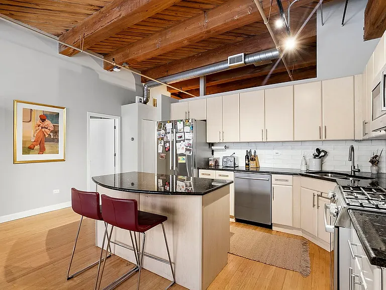 Fully equipped kitchen with island, gas stove, oven, microwave, dishwasher and garbage disposal!