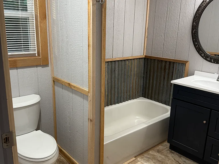 Master Bathroom with 42 inch shower, tub, 36 inch vanity with lots of outlets.