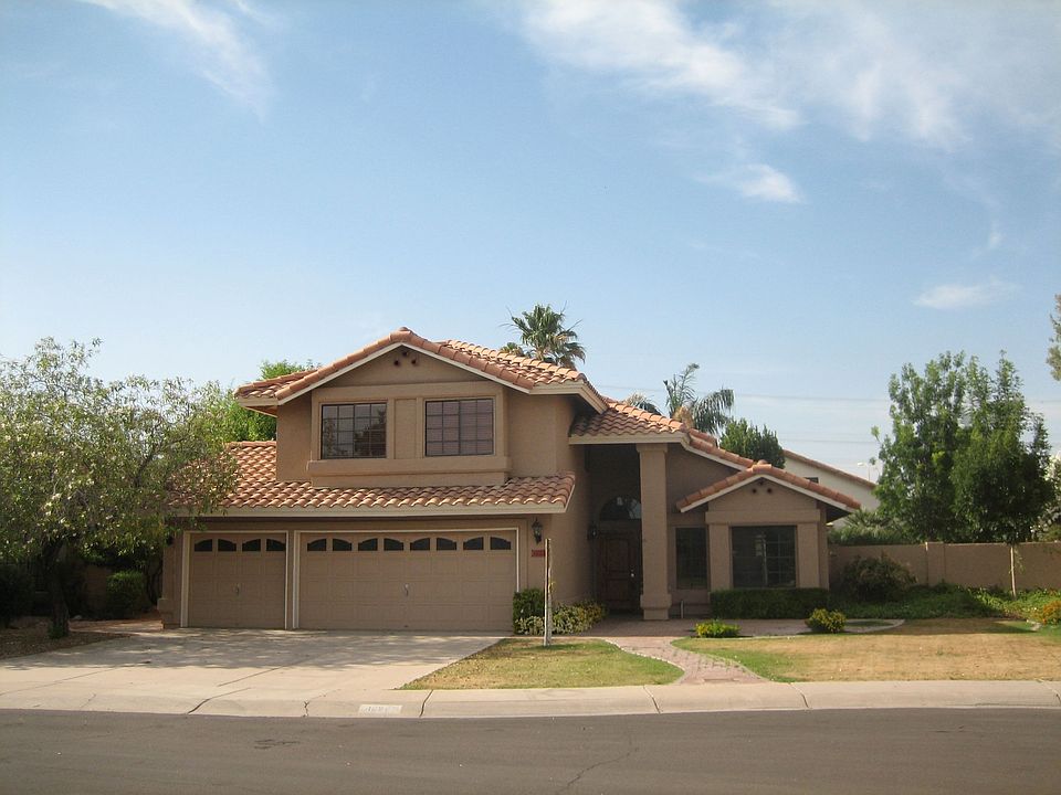 Front of home-designer paint, 3 car garage, large yard and front patio