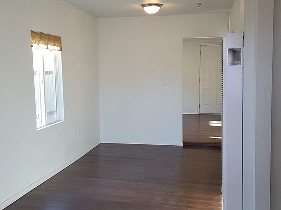 View from front door into living room and dining area.
