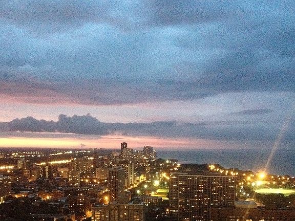 Sweeping view of lake and city from living room
