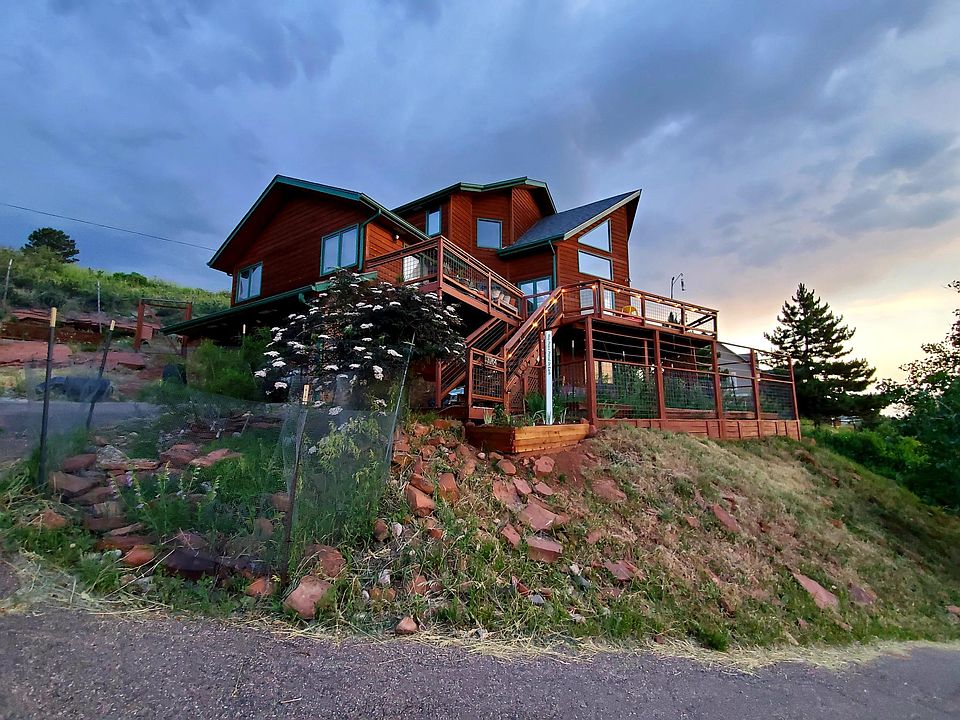 Incredible house, great roof lines, wrap around deck. Deer protected gardens (four raised garden boxes).